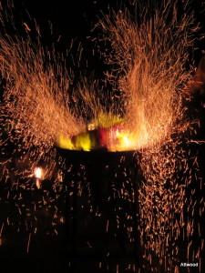 The sparks from the outdoor blacksmith were gorgeous flying through the air.