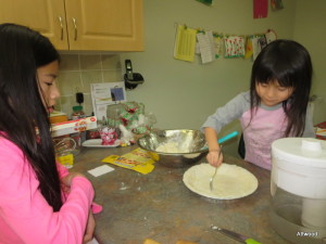 Girls even started to help.  A special thank you to the person who shared that rolling out the pastry in between parchment paper makes all of the difference.  It rolled beautifully and baked up just as nicely.