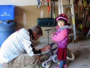 Helping Baba get her new bike road ready.